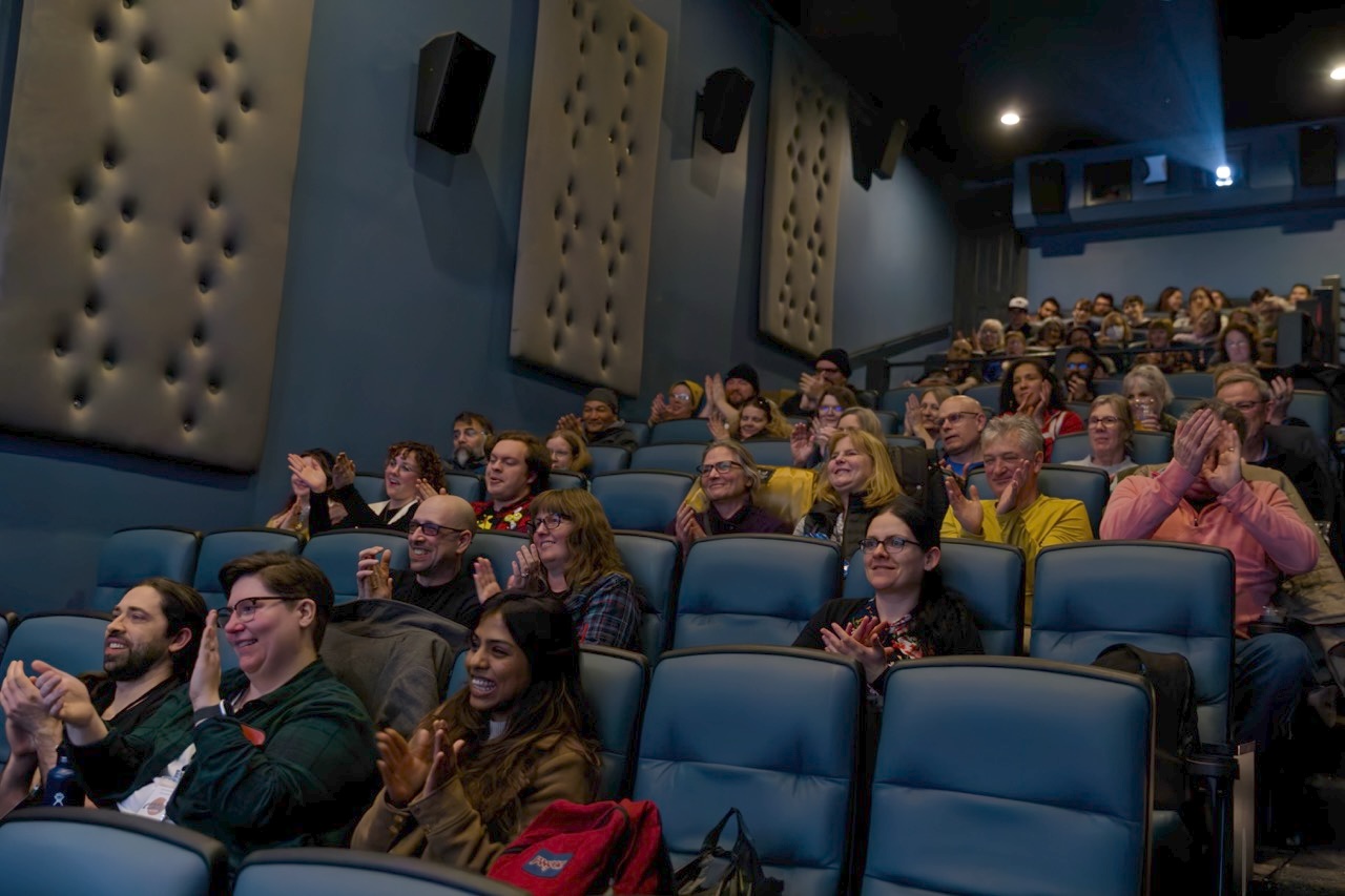 Audience enjoying comedy films at our festival